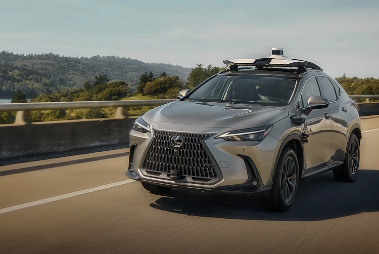 Lexus SUV equipped with sensors driving on highway using automated driving technology