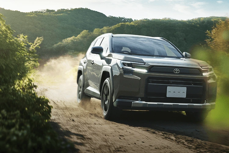 Toyota RAV4 SUV driving on rugged terrain demonstrating software-defined vehicle capability