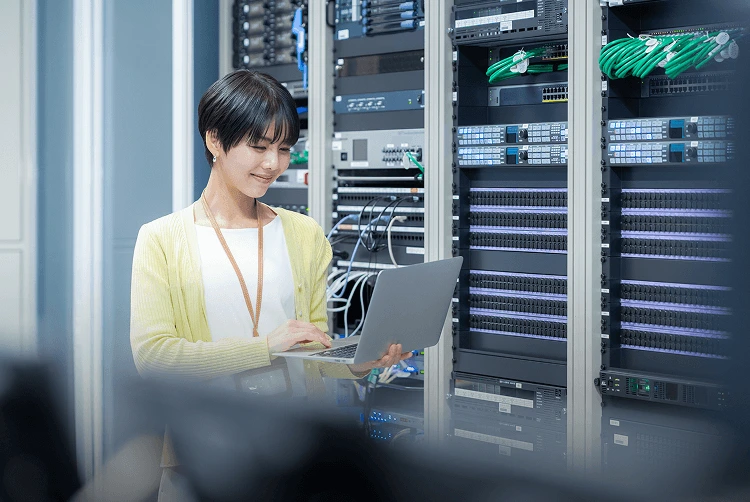Engineer managing cloud infrastructure in data center environment