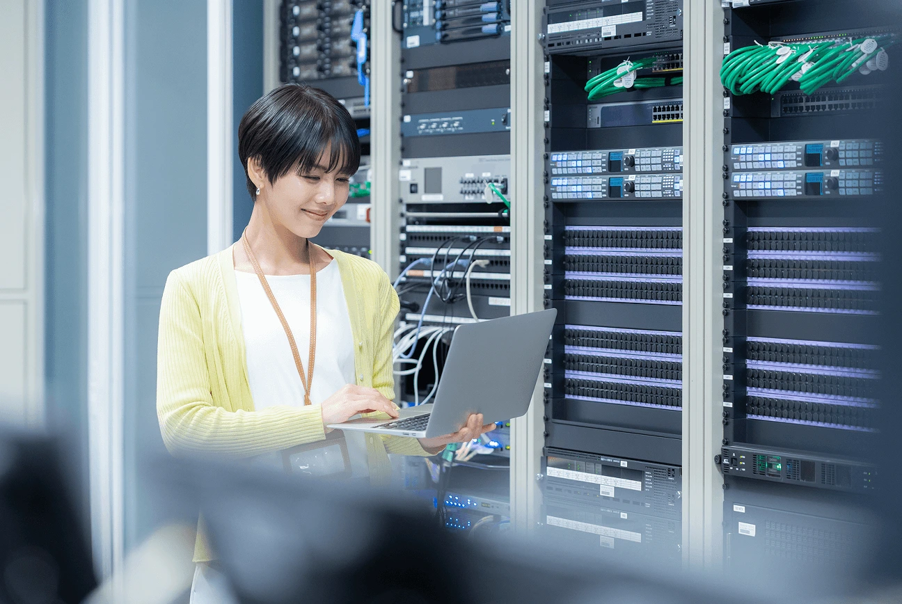 Engineer managing cloud infrastructure in data center environment