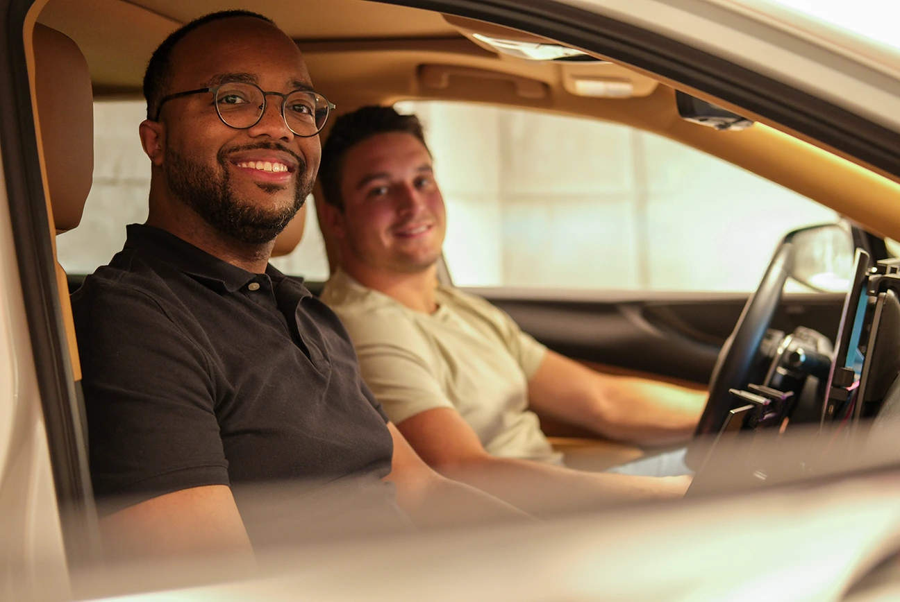Driver and passenger in vehicle representing safe and reliable mobility experience